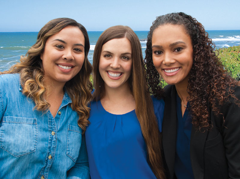 three smiling ladies